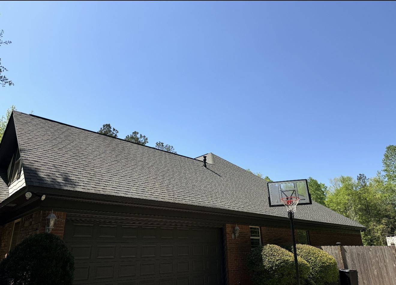 Uniform clean shingle roof after a soft wash roof cleaning in Columbus, GA